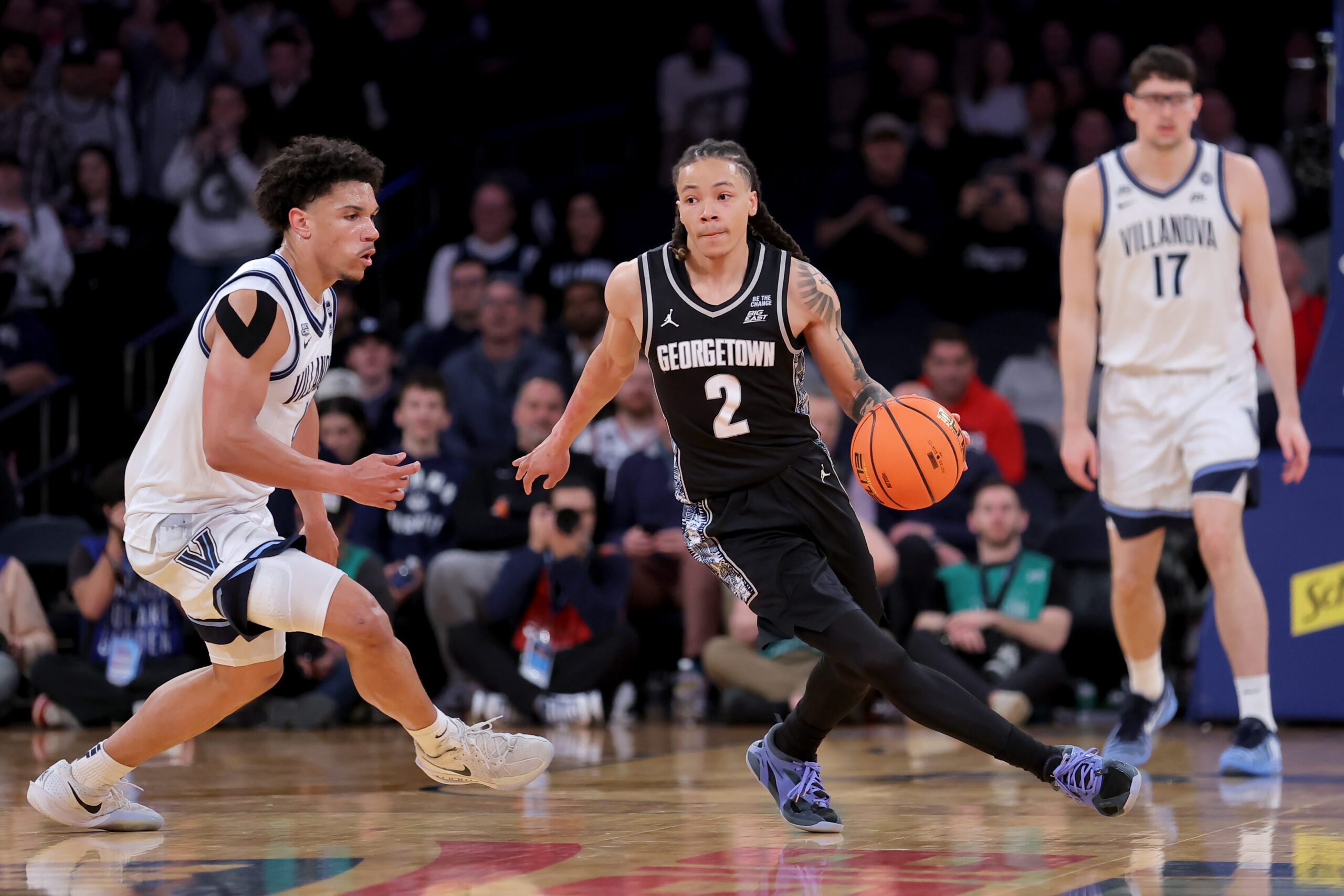 Mar 12, 2026; New York, NY, USA; Georgetown Hoyas guard Malik Mack (2) controls the ball against Villanova Wildcats guard Tyler Perkins (4) during the second half at Madison Square Garden. Mandatory Credit: Brad Penner-Imagn Images