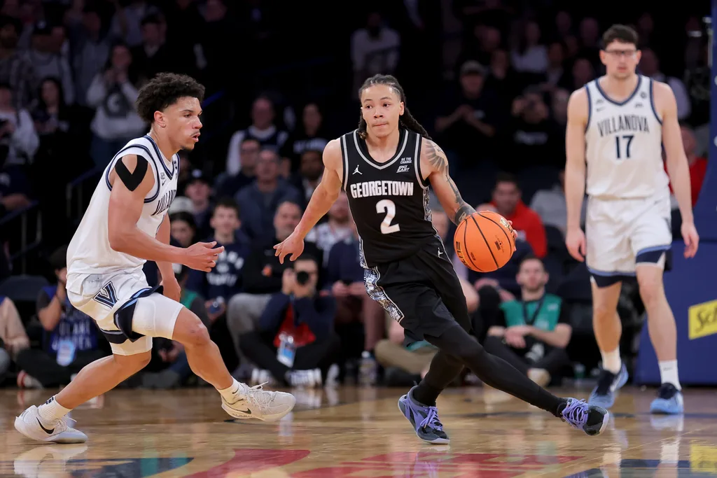 Mar 12, 2026; New York, NY, USA; Georgetown Hoyas guard Malik Mack (2) controls the ball against Villanova Wildcats guard Tyler Perkins (4) during the second half at Madison Square Garden. Mandatory Credit: Brad Penner-Imagn Images