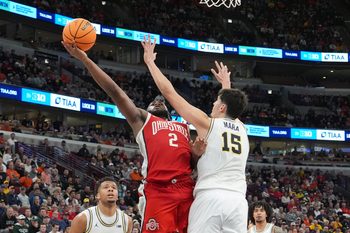 Mar 13, 2026; Chicago, IL, USA; Michigan Wolverines center Aday Mara (15) defends Ohio State Buckeyes guard Bruce Thornton (2) during the second half at United Center. Mandatory Credit: David Banks-Imagn Images