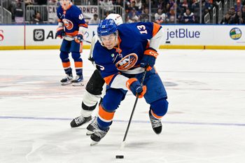 Mar 13, 2026; Elmont, New York, USA; New York Islanders center Mathew Barzal (13) skated with the puck against the Los Angeles Kings during the second period at UBS Arena. Mandatory Credit: Dennis Schneidler-Imagn Images