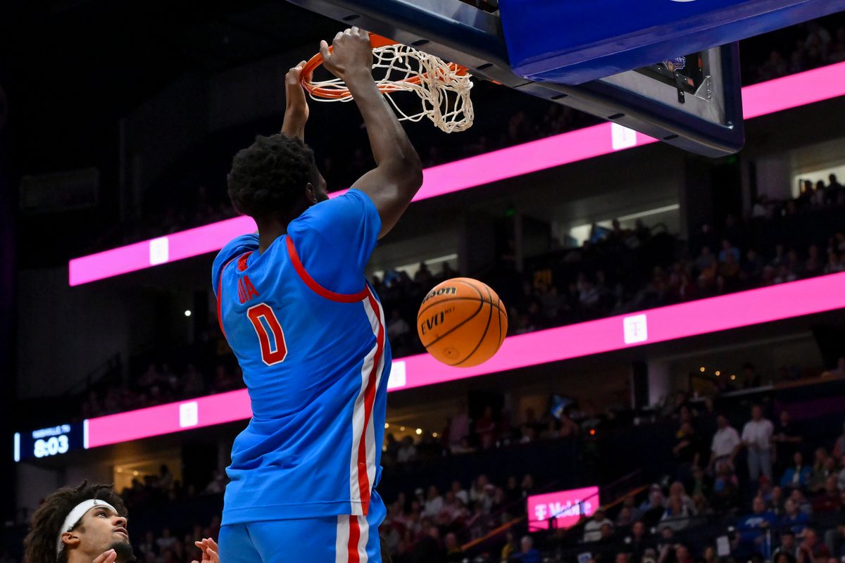 Mar 13, 2026; Nashville, TN, USA; Mississippi Rebels forward Malik Dia (0) dunks the ball against the Alabama Crimson Tide during the second half at Bridgestone Arena. Mandatory Credit: Steve Roberts-Imagn Images