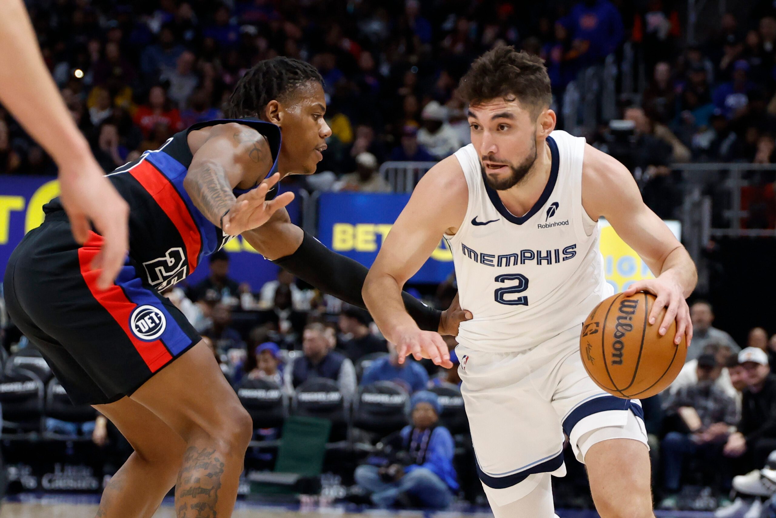 Mar 13, 2026; Detroit, Michigan, USA;  Memphis Grizzlies guard Ty Jerome (2) dribbles defended by Detroit Pistons guard Marcus Sasser (25) in the second half at Little Caesars Arena. Mandatory Credit: Rick Osentoski-Imagn Images