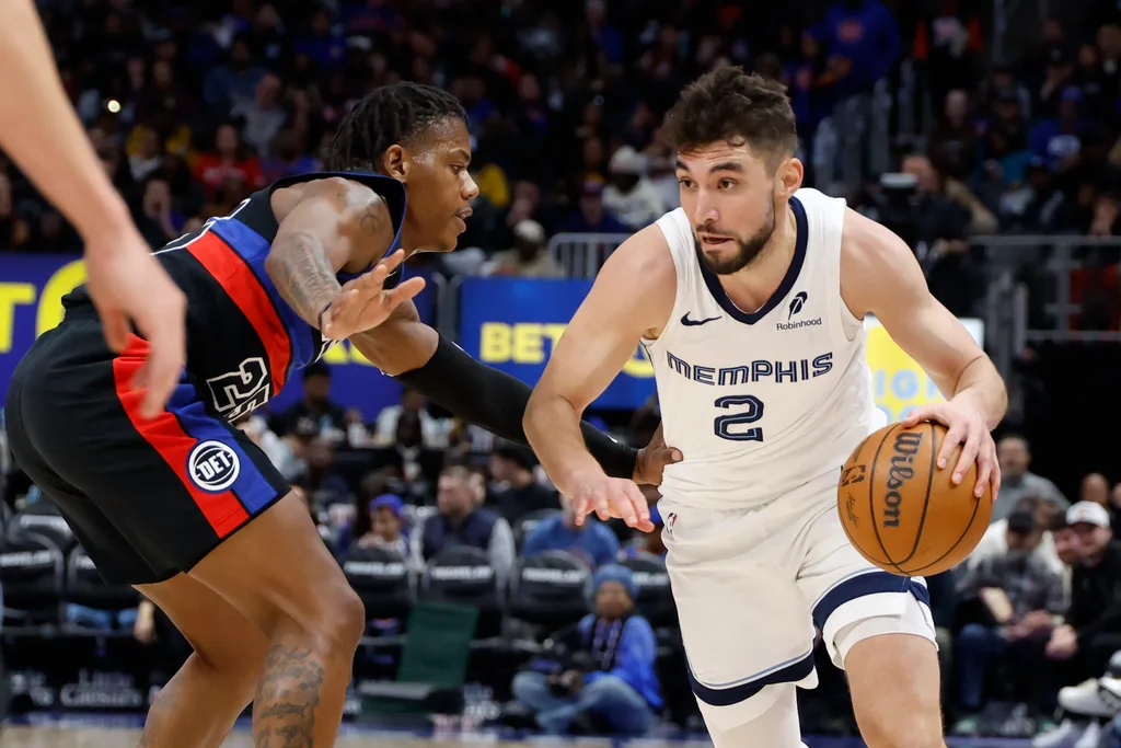 Mar 13, 2026; Detroit, Michigan, USA; Memphis Grizzlies guard Ty Jerome (2) dribbles defended by Detroit Pistons guard Marcus Sasser (25) in the second half at Little Caesars Arena. Mandatory Credit: Rick Osentoski-Imagn Images