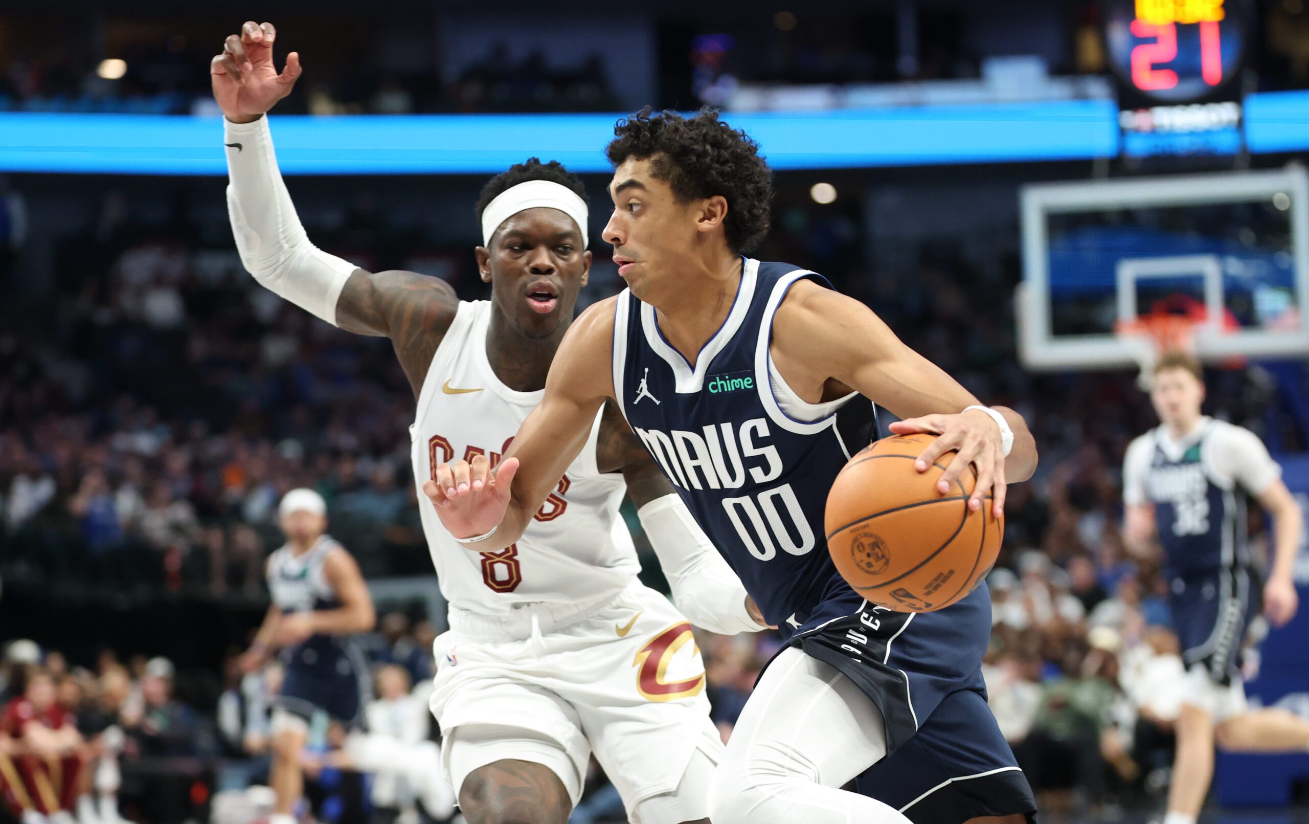 Mar 13, 2026; Dallas, Texas, USA;  Dallas Mavericks guard Max Christie (00) drives to the basket past Cleveland Cavaliers guard Dennis Schroder (8) during the second half at American Airlines Center. Mandatory Credit: Kevin Jairaj-Imagn Images