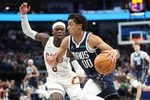 Mar 13, 2026; Dallas, Texas, USA;  Dallas Mavericks guard Max Christie (00) drives to the basket past Cleveland Cavaliers guard Dennis Schroder (8) during the second half at American Airlines Center. Mandatory Credit: Kevin Jairaj-Imagn Images
