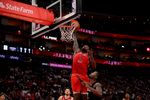 Mar 13, 2026; Houston, Texas, USA; New Orleans Pelicans forward Zion Williamson (1) dunks against Houston Rockets forward Dorian Finney-Smith (2) during the fourth quarter at Toyota Center. Mandatory Credit: Erik Williams-Imagn Images