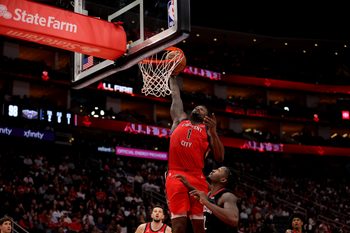 Mar 13, 2026; Houston, Texas, USA; New Orleans Pelicans forward Zion Williamson (1) dunks against Houston Rockets forward Dorian Finney-Smith (2) during the fourth quarter at Toyota Center. Mandatory Credit: Erik Williams-Imagn Images