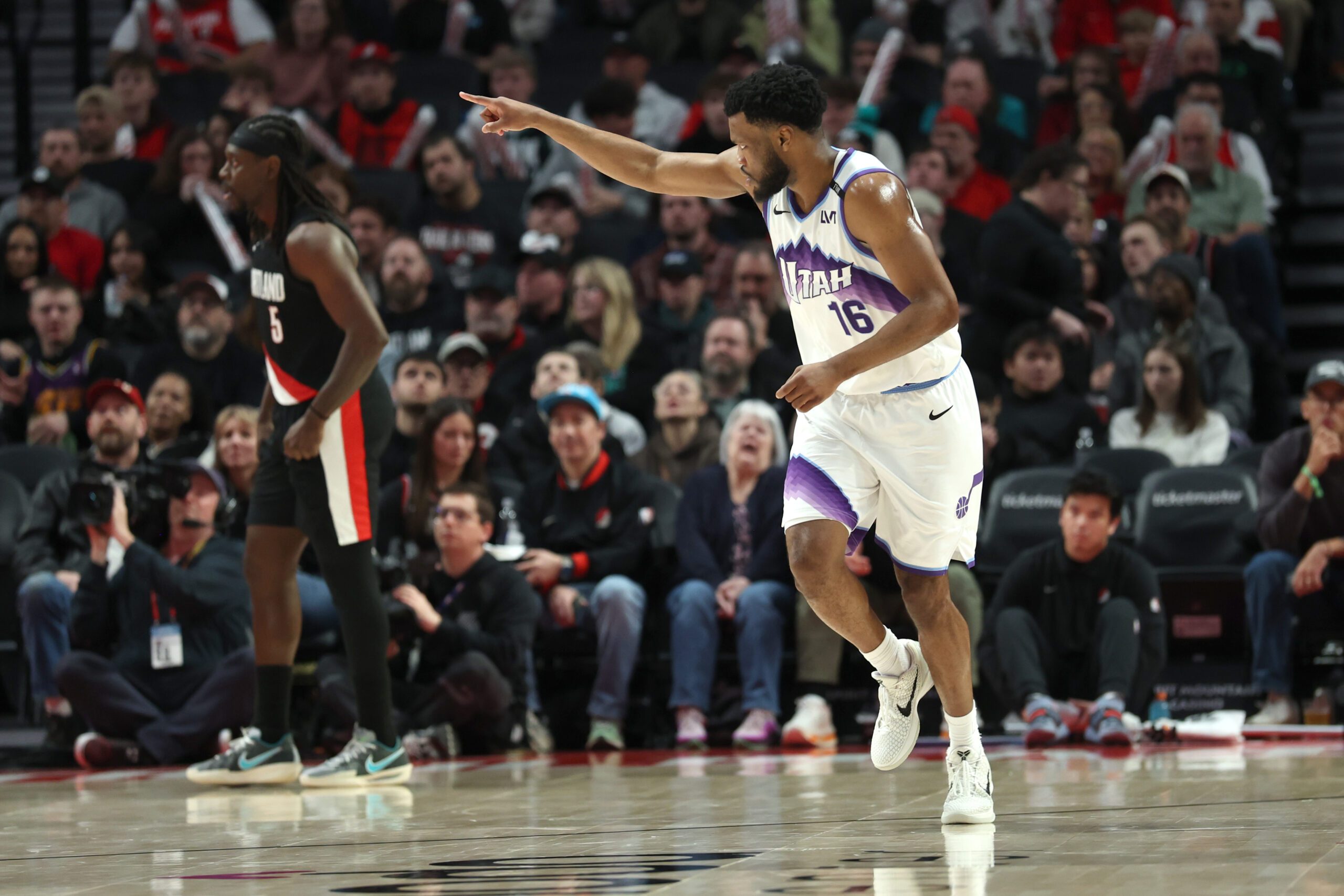Mar 13, 2026; Portland, Oregon, USA;  Utah Jazz guard Elijah Harkless (16) reacts after scoring against the Portland Trail Blazers during the second half at Moda Center. Mandatory Credit: Jaime Valdez-Imagn Images