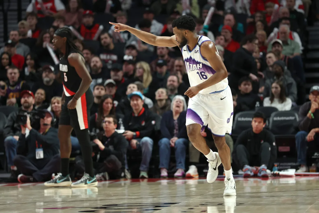 Mar 13, 2026; Portland, Oregon, USA; Utah Jazz guard Elijah Harkless (16) reacts after scoring against the Portland Trail Blazers during the second half at Moda Center. Mandatory Credit: Jaime Valdez-Imagn Images