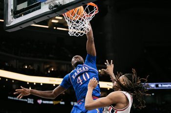 Mar 13, 2026; Kansas City, MO, USA; Kansas Jayhawks forward Flory Bidunga (40) dunks during the second half against the Houston Cougars at T-Mobile Center. Mandatory Credit: William Purnell-Imagn Images