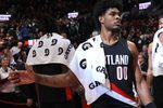 Mar 13, 2026; Portland, Oregon, USA;  Portland Trail Blazers guard Scoot Henderson (00) high-fives teammates after the Trail Blazers defeated Utah Jazz 124-114 at Moda Center. Mandatory Credit: Jaime Valdez-Imagn Images