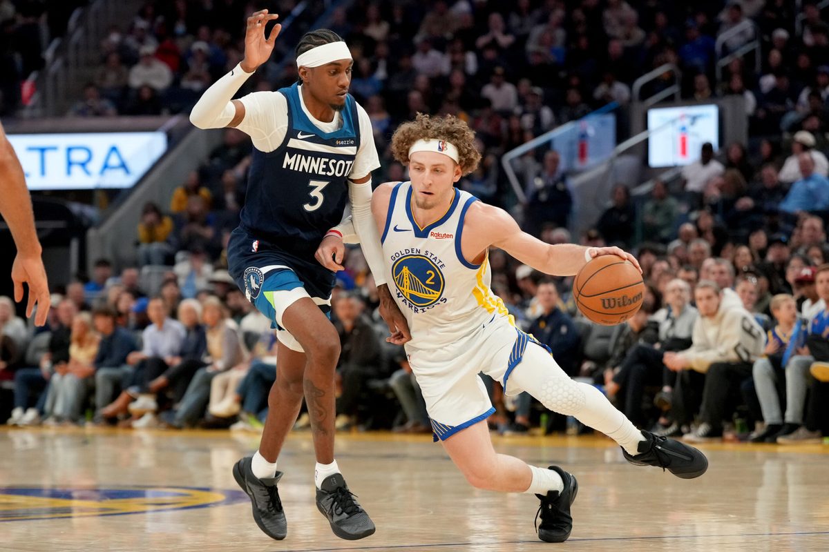 Mar 13, 2026; San Francisco, California, USA; Golden State Warriors guard Brandin Podziemski (2) dribbles the ball next to Minnesota Timberwolves forward Jaden McDaniels (3) in the fourth quarter at the Chase Center. Mandatory Credit: Cary Edmondson-Imagn Images