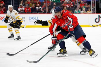 Mar 9, 2026; Washington, District of Columbia, USA; Washington Capitals left wing Alex Ovechkin (8) skates with the puck as Boston Bruins defenseman Charlie McAvoy (73) defends during the first period at Capital One Arena. Mandatory Credit: Geoff Burke-Imagn Images