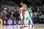 Mar 14, 2026; San Antonio, Texas, USA;  San Antonio Spurs forward Victor Wembanyama (1) hugs guard Stephon Castle (5) after the game against the Charlotte Hornets at Frost Bank Center. Mandatory Credit: Daniel Dunn-Imagn Images