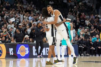 Mar 14, 2026; San Antonio, Texas, USA;  San Antonio Spurs forward Victor Wembanyama (1) hugs guard Stephon Castle (5) after the game against the Charlotte Hornets at Frost Bank Center. Mandatory Credit: Daniel Dunn-Imagn Images