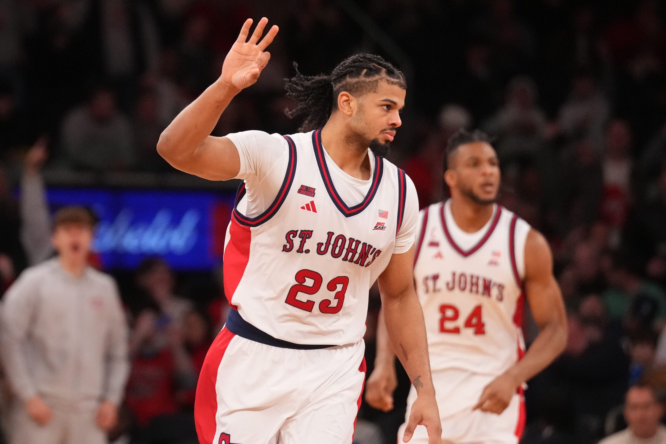 Mar 14, 2026; New York, NY, USA; St. John's Red Storm forward Bryce Hopkins (23) reacts after a made three point basket against the Connecticut Huskies during the second half of the men's Big East Conference Tournament Championship at Madison Square Garden. Mandatory Credit: Robert Deutsch-Imagn Images