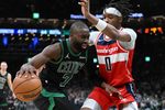 Mar 14, 2026; Boston, Massachusetts, USA; Boston Celtics guard Jaylen Brown (7) drives to the basket against Washington Wizards guard Bilal Coulibaly (0) during the first half at the TD Garden. Mandatory Credit: Brian Fluharty-Imagn Images