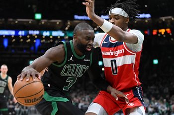 Mar 14, 2026; Boston, Massachusetts, USA; Boston Celtics guard Jaylen Brown (7) drives to the basket against Washington Wizards guard Bilal Coulibaly (0) during the first half at the TD Garden. Mandatory Credit: Brian Fluharty-Imagn Images
