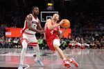 Mar 14, 2026; Kansas City, MO, USA; Houston Cougars guard Kingston Flemings (4) drives to the hoop past Arizona Wildcats guard Jaden Bradley (0) during the second half during the men's Big 12 Conference Tournament Championship at T-Mobile Center. Mandatory Credit: William Purnell-Imagn Images