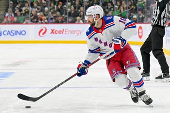 Mar 14, 2026; Saint Paul, Minnesota, USA;  New York Rangers forward Vincent Trocheck (16) controls the puck against the Minnesota Wild during the third period at Grand Casino Arena. Mandatory Credit: Nick Wosika-Imagn Images