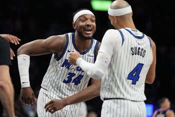 Mar 14, 2026; Miami, Florida, USA;  Orlando Magic guard Jalen Suggs (4) and center Wendell Carter Jr. (34) celebrate a win over the Miami Heat at Kaseya Center. Mandatory Credit: Jim Rassol-Imagn Images