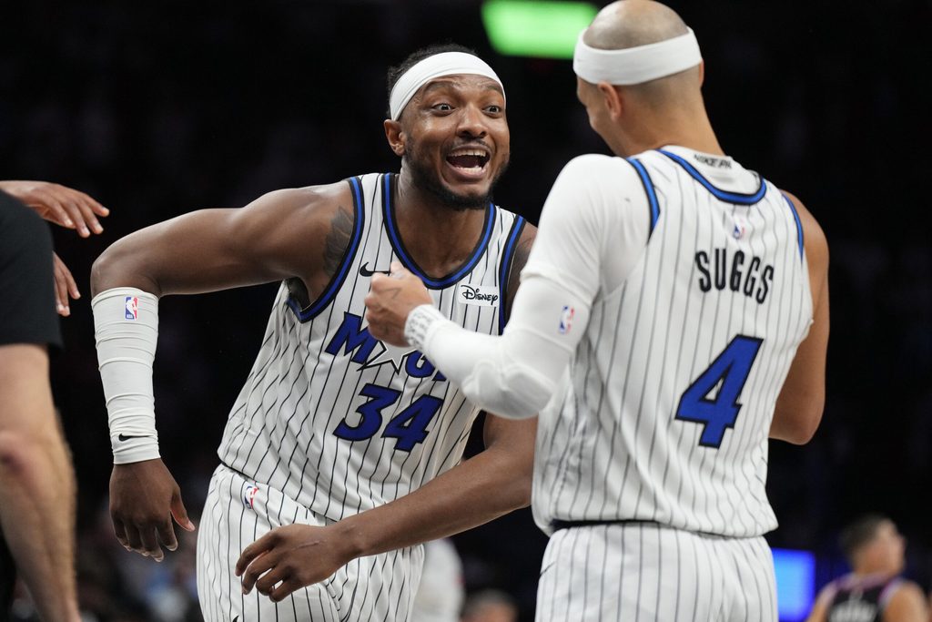 Mar 14, 2026; Miami, Florida, USA; Orlando Magic guard Jalen Suggs (4) and center Wendell Carter Jr. (34) celebrate a win over the Miami Heat at Kaseya Center. Mandatory Credit: Jim Rassol-Imagn Images