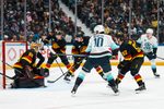 Mar 14, 2026; Vancouver, British Columbia, CAN; Vancouver Canucks forward Liam Ohgren (92) and forward Drew O'Connor (18) and defenseman Victor Mancini (90) watch as Seattle Kraken forward Matty Beniers (10) scores on goalie Nikita Tolopilo (60) in the third period at Rogers Arena. Mandatory Credit: Bob Frid-Imagn Images