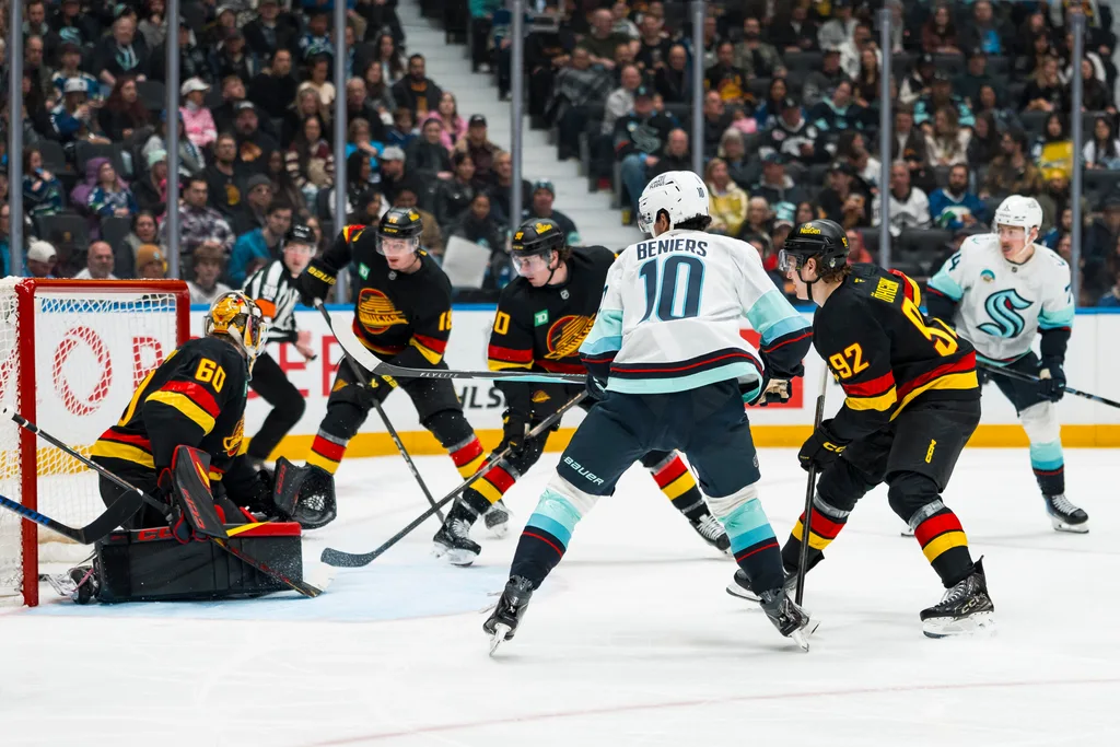 Mar 14, 2026; Vancouver, British Columbia, CAN; Vancouver Canucks forward Liam Ohgren (92) and forward Drew O'Connor (18) and defenseman Victor Mancini (90) watch as Seattle Kraken forward Matty Beniers (10) scores on goalie Nikita Tolopilo (60) in the third period at Rogers Arena. Mandatory Credit: Bob Frid-Imagn Images