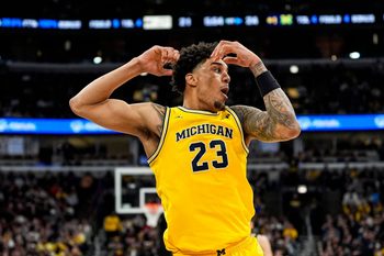 Michigan forward Yaxel Lendeborg (23) reacts being called a personal foul against him during the first half of Big Ten Tournament final against Purdue at United Center in Chicago on Sunday, March 15, 2026.