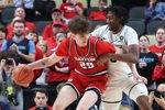 Mar 15, 2026; Pittsburgh, PA, USA;  Dayton Flyers forward Amael L'etang (29) dribbles while closely guarded by VCU Rams forward Michael Belle (right) during the second half in the Atlantic 10 Conference Tournament Championship game at PPG Paints Arena. Mandatory Credit: Charles LeClaire-Imagn Images