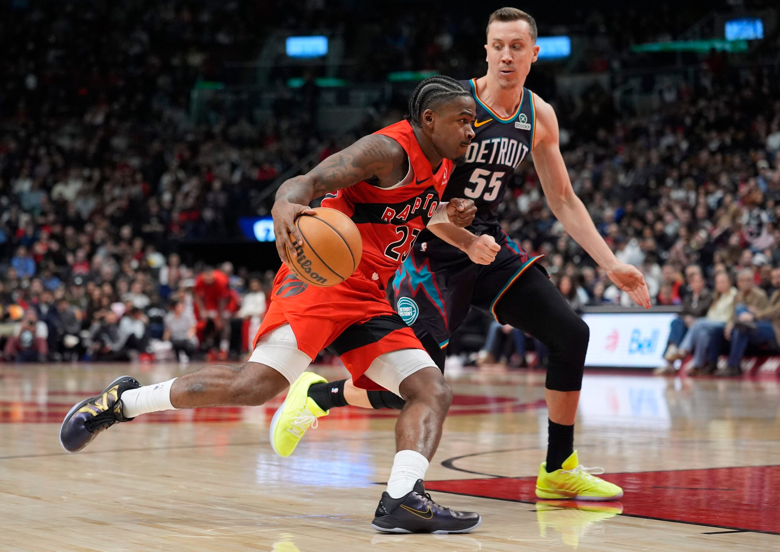 Mar 15, 2026; Toronto, Ontario, CAN; Toronto Raptors guard Jamal Shead (23) drives the the basket against Detroit Pistons guard Duncan Robinson (55) during the second half at Scotiabank Arena. Mandatory Credit: John E. Sokolowski-Imagn Images