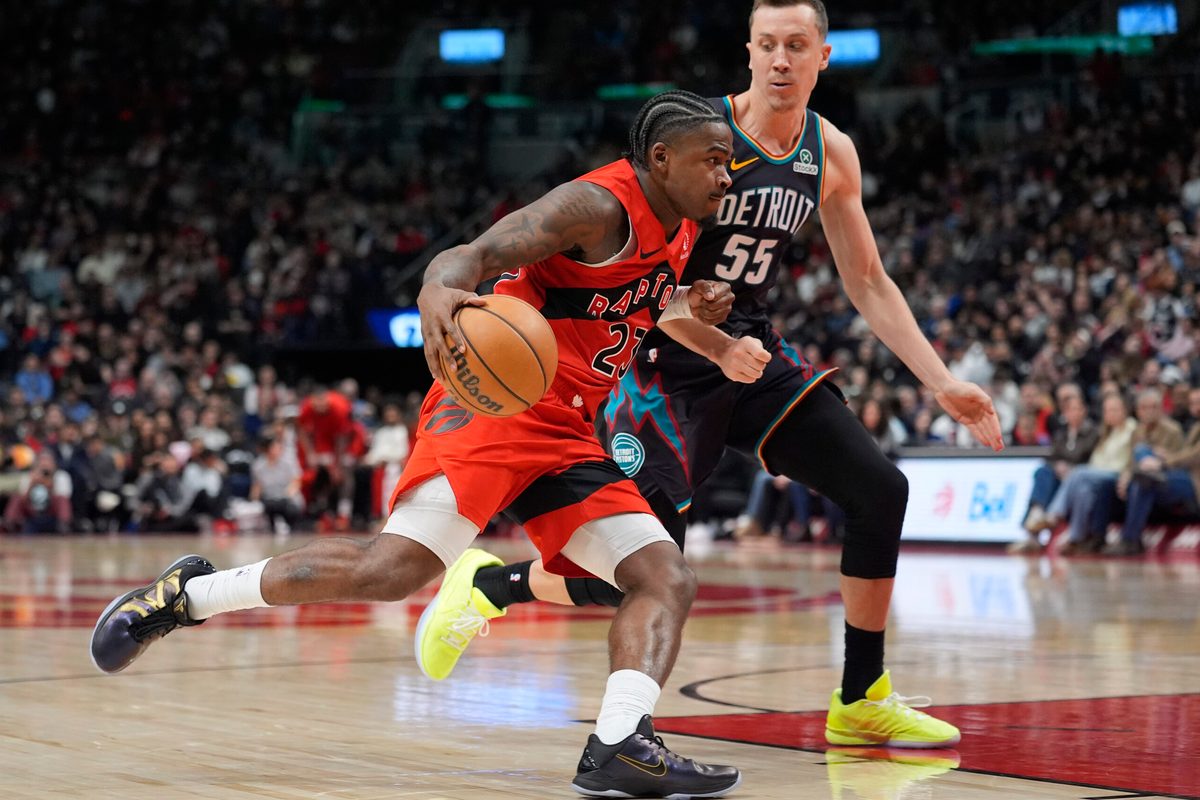 Mar 15, 2026; Toronto, Ontario, CAN; Toronto Raptors guard Jamal Shead (23) drives the the basket against Detroit Pistons guard Duncan Robinson (55) during the second half at Scotiabank Arena. Mandatory Credit: John E. Sokolowski-Imagn Images
