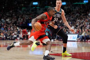 Mar 15, 2026; Toronto, Ontario, CAN; Toronto Raptors guard Jamal Shead (23) drives the the basket against Detroit Pistons guard Duncan Robinson (55) during the second half at Scotiabank Arena. Mandatory Credit: John E. Sokolowski-Imagn Images