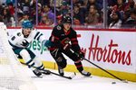 Mar 15, 2026; Ottawa, Ontario, CAN; Ottawa Senators center Tim Stutzle (18) skates with the puck against San Jose Sharks defenseman Sam Dickinson (6) during the first period at Canadian Tire Centre. Mandatory Credit: Keito Newman-Imagn Images