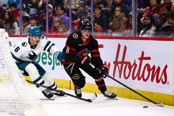 Mar 15, 2026; Ottawa, Ontario, CAN; Ottawa Senators center Tim Stutzle (18) skates with the puck against San Jose Sharks defenseman Sam Dickinson (6) during the first period at Canadian Tire Centre. Mandatory Credit: Keito Newman-Imagn Images
