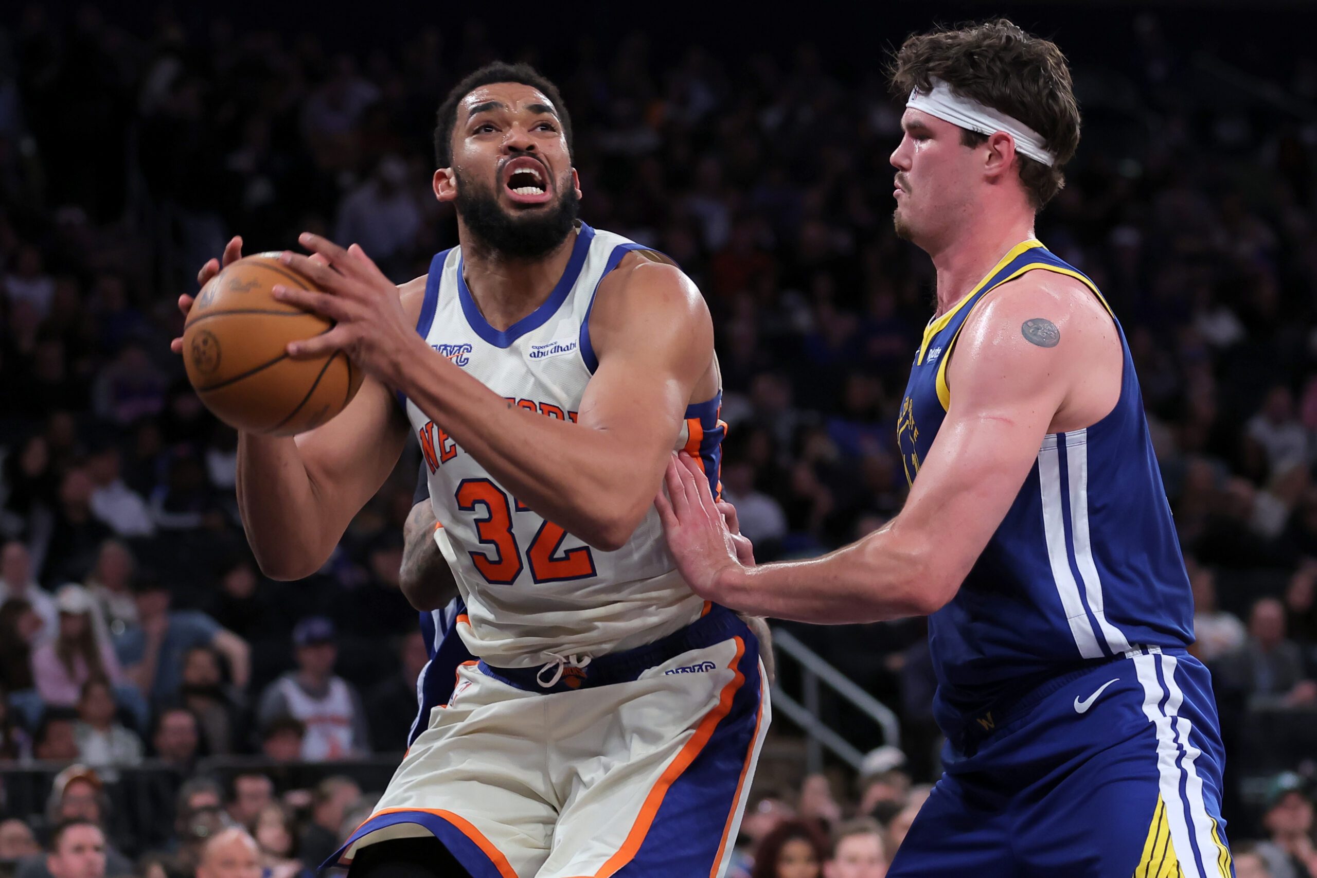 Mar 15, 2026; New York, New York, USA; New York Knicks center Karl-Anthony Towns (32) looks to shoot the ball against Golden State Warriors center Quinten Post (21) during the third quarter at Madison Square Garden. Mandatory Credit: Brad Penner-Imagn Images