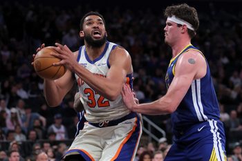 Mar 15, 2026; New York, New York, USA; New York Knicks center Karl-Anthony Towns (32) looks to shoot the ball against Golden State Warriors center Quinten Post (21) during the third quarter at Madison Square Garden. Mandatory Credit: Brad Penner-Imagn Images