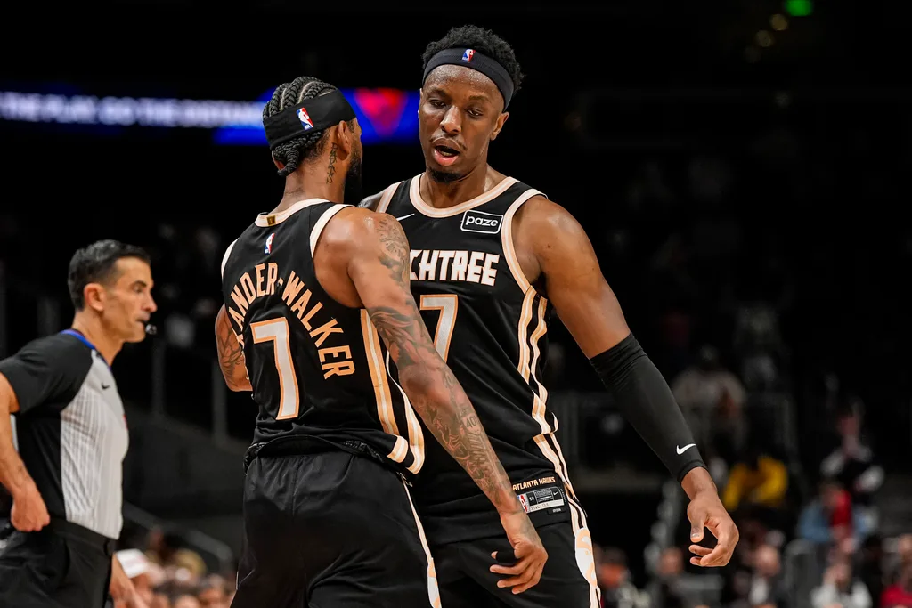 Mar 16, 2026; Atlanta, Georgia, USA; Atlanta Hawks guard Nickeil Alexander-Walker (7) and forward Onyeka Okongwu (17) react during the game against the Orlando Magic during the second half at State Farm Arena. Mandatory Credit: Dale Zanine-Imagn Images