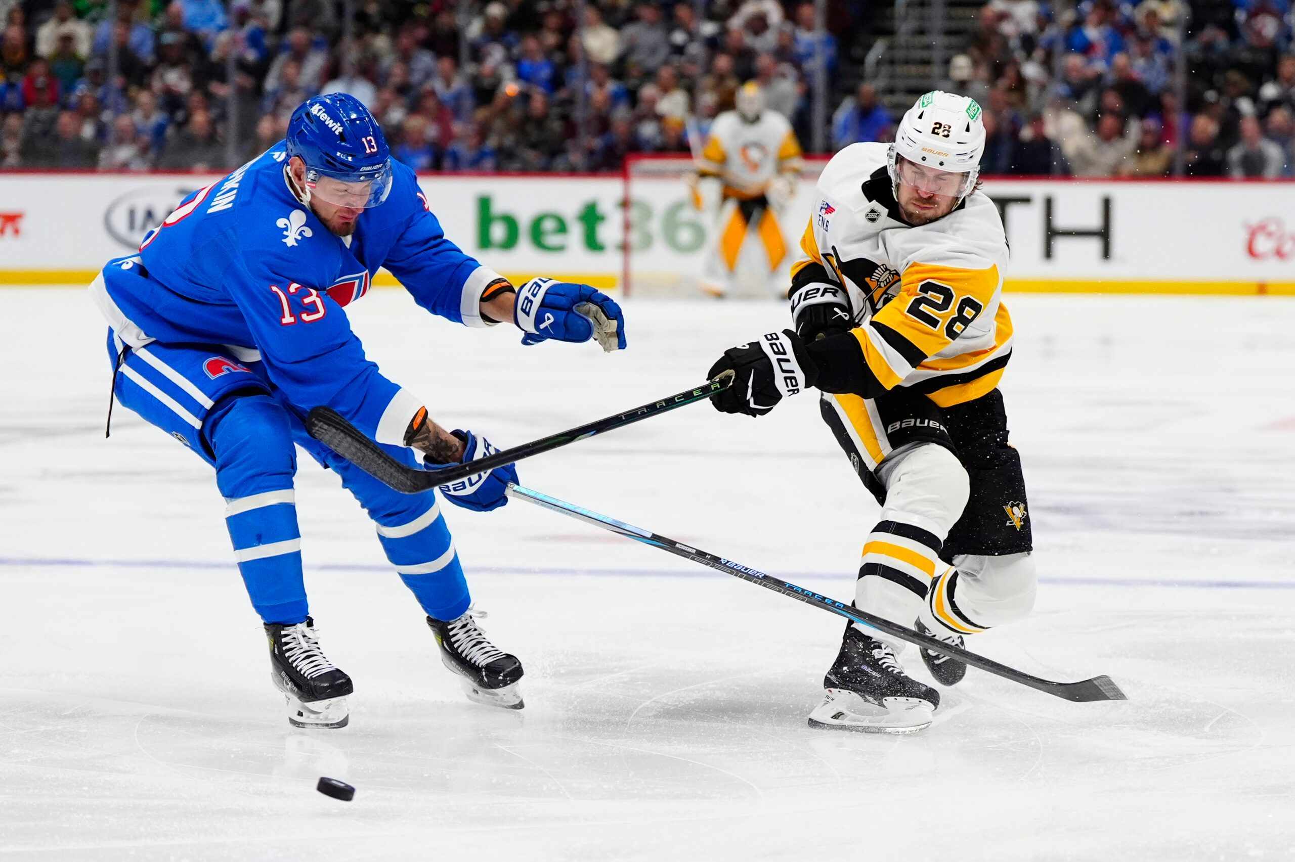 Mar 16, 2026; Denver, Colorado, USA; Colorado Avalanche right wing Valeri Nichushkin (13) defends on Pittsburgh Penguins defenseman Parker Wotherspoon (28) in the third period at Ball Arena. Mandatory Credit: Ron Chenoy-Imagn Images