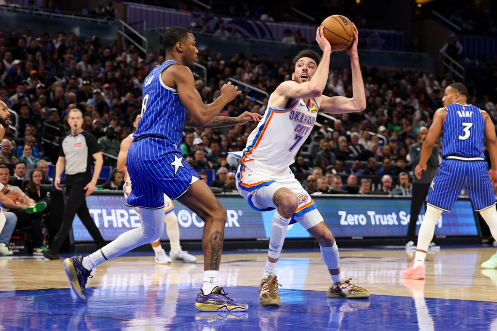 Mar 17, 2026; Orlando, Florida, USA; Oklahoma City Thunder center Chet Holmgren (7) is guarded by Orlando Magic forward Jamal Cain (8) in the fourth quarter at Kia Center. Mandatory Credit: Nathan Ray Seebeck-Imagn Images