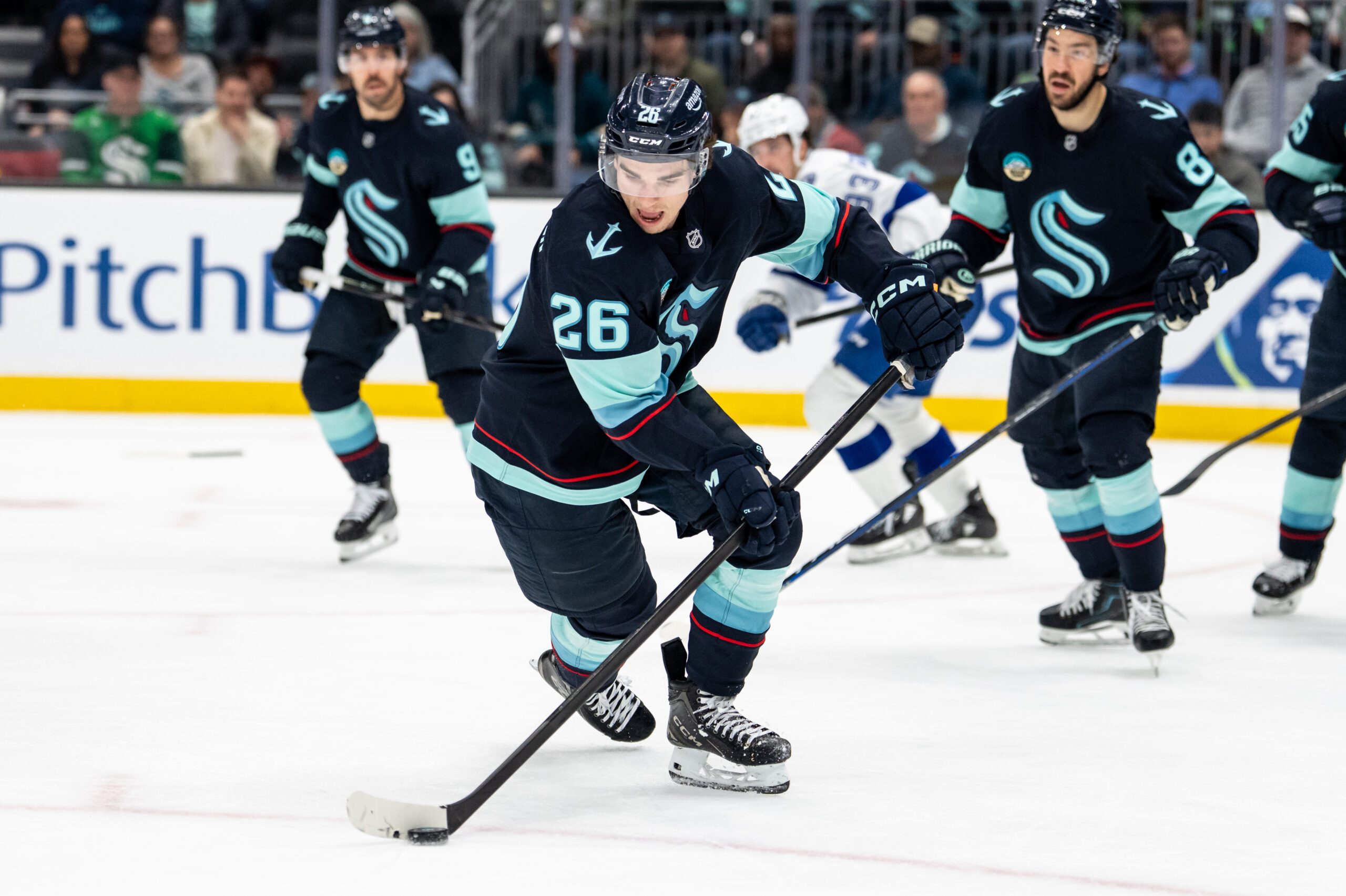 Mar 17, 2026; Seattle, Washington, USA; Seattle Kraken forward Ryan Winterton (26) skates with the puck during the third period against the Tampa Bay Lightning at Climate Pledge Arena. Mandatory Credit: Stephen Brashear-Imagn Images