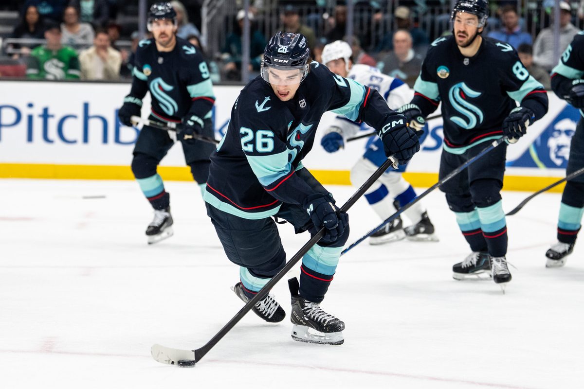 Mar 17, 2026; Seattle, Washington, USA; Seattle Kraken forward Ryan Winterton (26) skates with the puck during the third period against the Tampa Bay Lightning at Climate Pledge Arena. Mandatory Credit: Stephen Brashear-Imagn Images