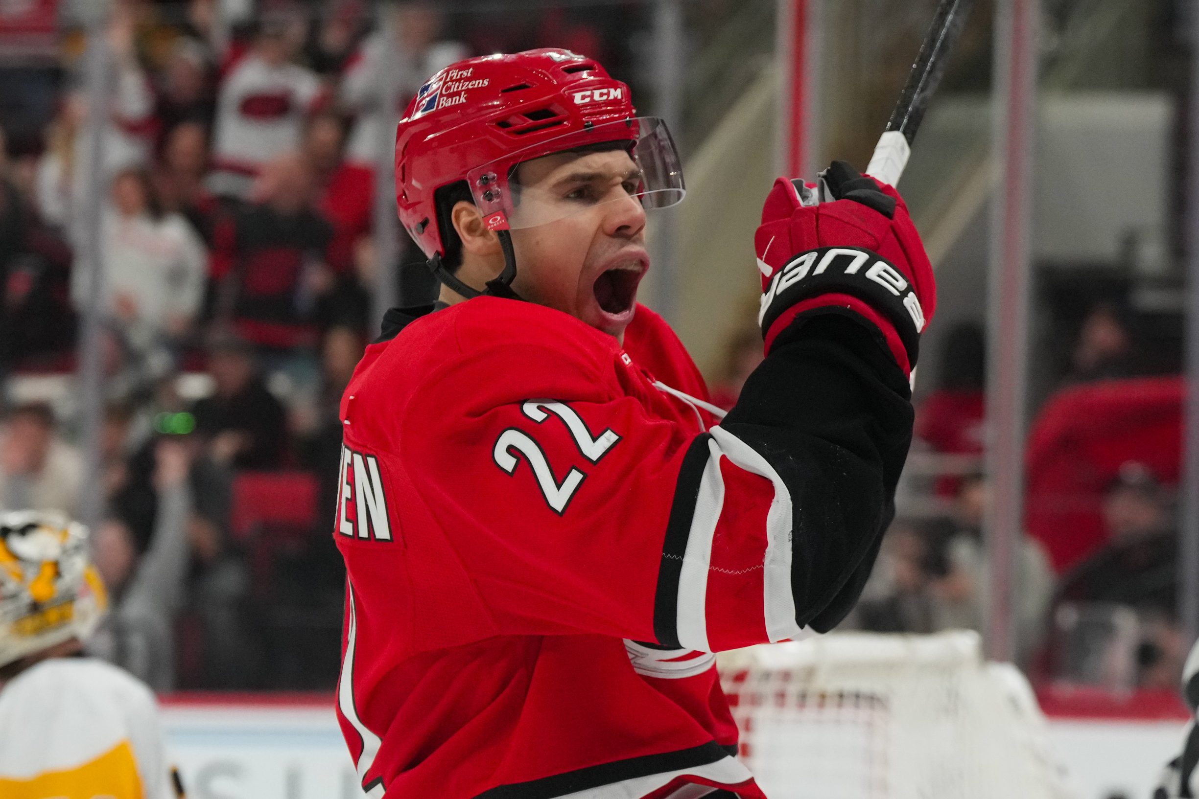 Mar 18, 2026; Raleigh, North Carolina, USA; Carolina Hurricanes center Logan Stankoven (22) celebrates scoring against the Pittsburgh Penguins during the third period at Lenovo Center. Mandatory Credit: James Guillory-Imagn Images