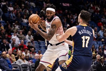 Mar 18, 2026; New Orleans, Louisiana, USA;  LA Clippers forward Isaiah Jackson (23) dribbles against New Orleans Pelicans forward/center Karlo Matković (17) during second half at Smoothie King Center. Mandatory Credit: Stephen Lew-Imagn Images