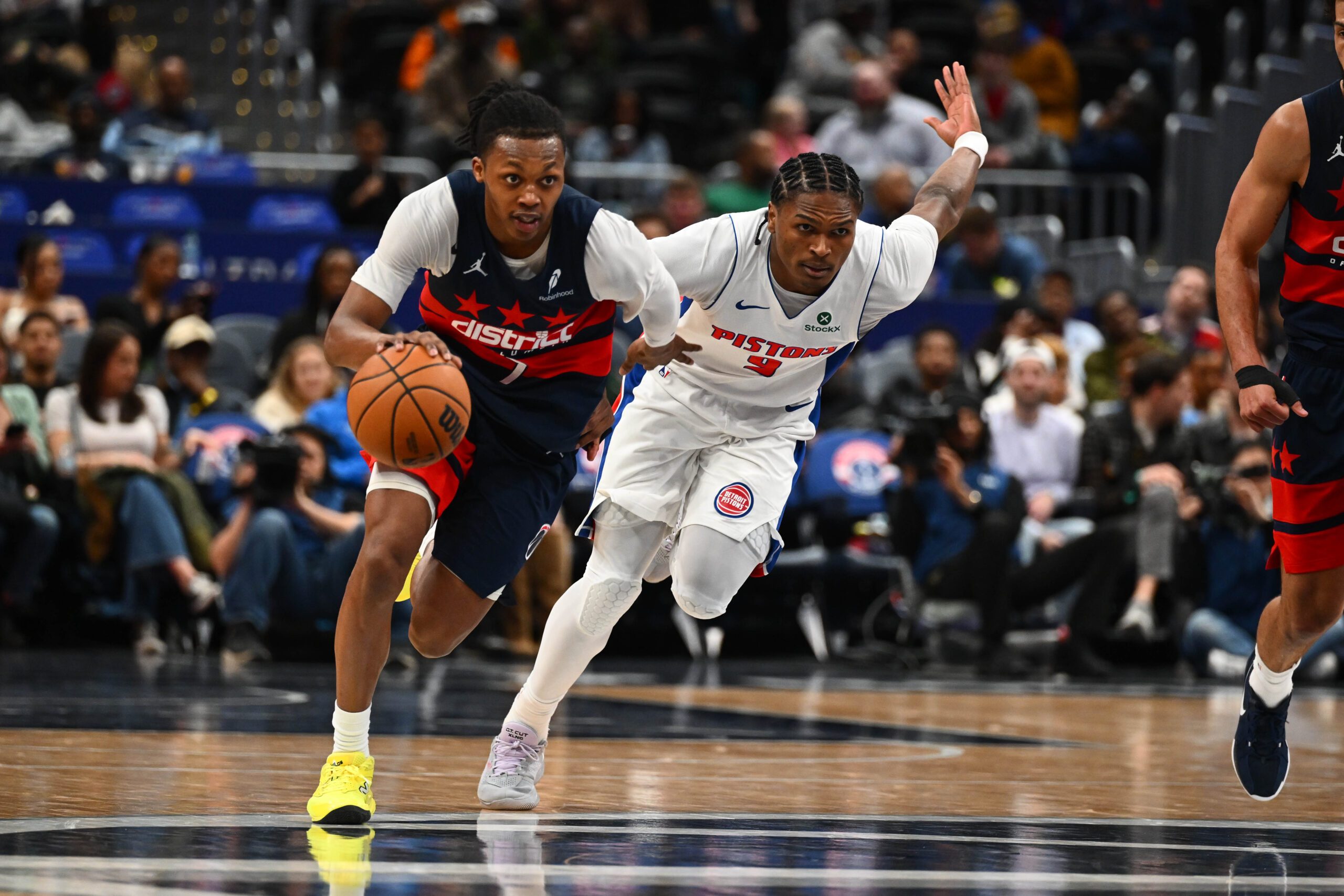 Mar 19, 2026; Washington, District of Columbia, USA; Washington Wizards guard Bub Carrington (7) advances the ball as Detroit Pistons guard Ausar Thompson (9) chases during the second half at Capital One Arena. Mandatory Credit: Brad Mills-Imagn Images