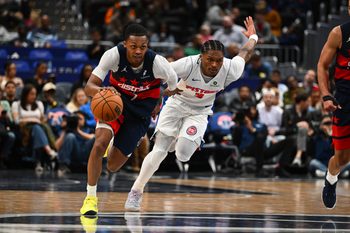 Mar 19, 2026; Washington, District of Columbia, USA; Washington Wizards guard Bub Carrington (7) advances the ball as Detroit Pistons guard Ausar Thompson (9) chases during the second half at Capital One Arena. Mandatory Credit: Brad Mills-Imagn Images