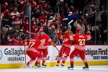 Mar 19, 2026; Detroit, Michigan, USA; Detroit Red Wings right wing Alex DeBrincat (93) celebrates with defenseman Simon Edvinsson (77) and left wing J.T. Compher (37) after scoring a goal during the third period against the Montreal Canadiens at Little Caesars Arena. Mandatory Credit: Tim Fuller-Imagn Images