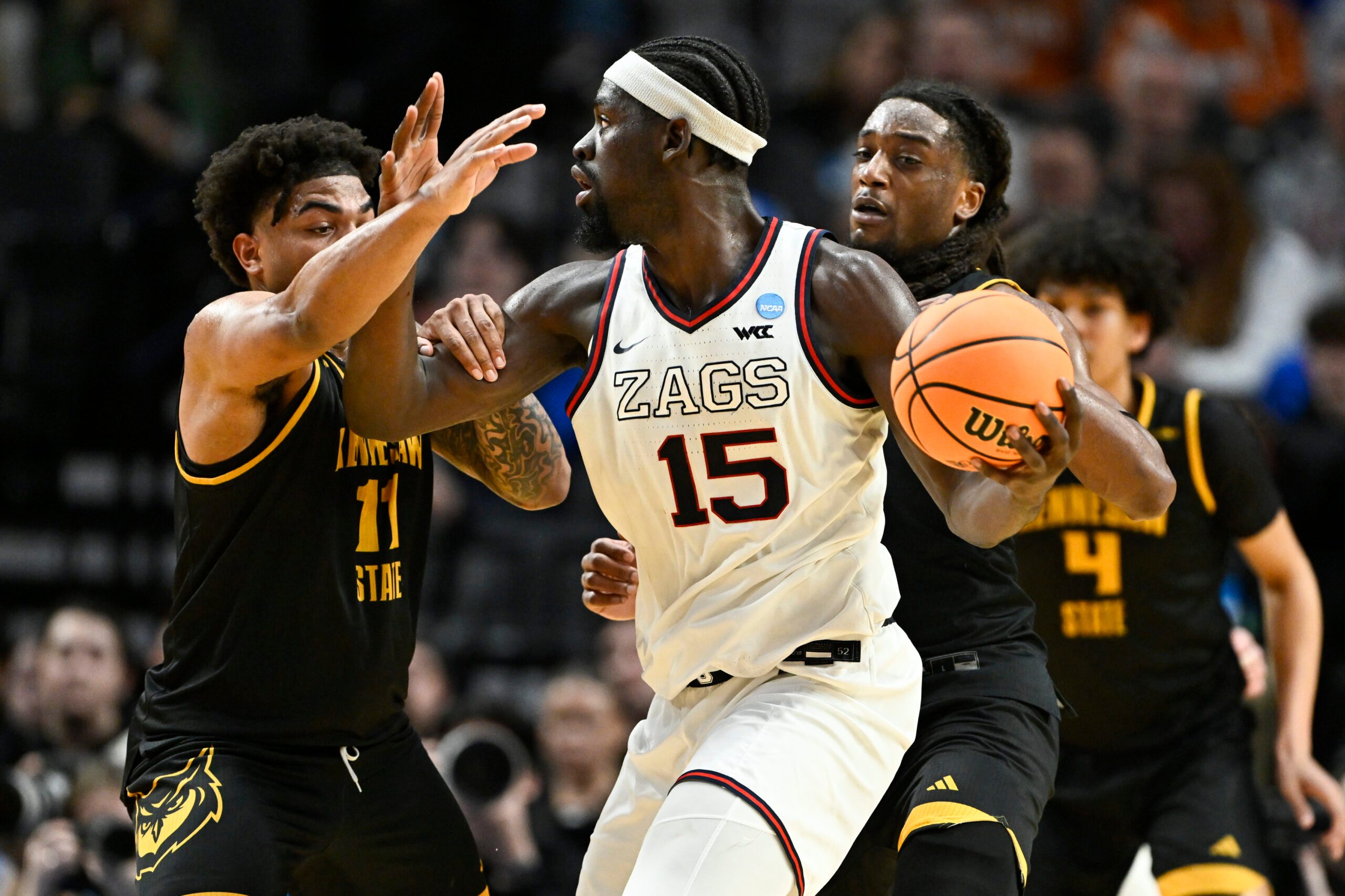Mar 19, 2026; Portland, OR, USA; Kennesaw State Owls guard RJ Johnson (11) defends against Gonzaga Bulldogs forward Graham Ike (15) during the first half of a first round game of the men's 2026 NCAA Tournament at Moda Center. Mandatory Credit: Craig Strobeck-Imagn Images