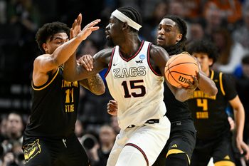 Mar 19, 2026; Portland, OR, USA; Kennesaw State Owls guard RJ Johnson (11) defends against Gonzaga Bulldogs forward Graham Ike (15) during the first half of a first round game of the men's 2026 NCAA Tournament at Moda Center. Mandatory Credit: Craig Strobeck-Imagn Images