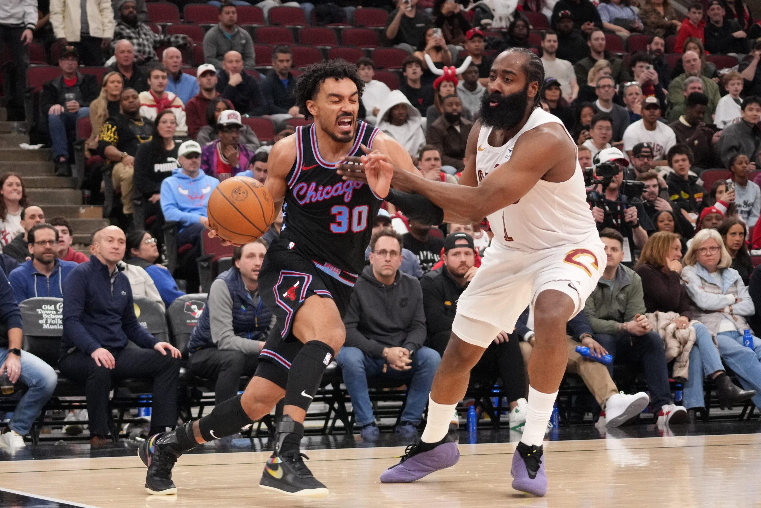 Mar 19, 2026; Chicago, Illinois, USA; Cleveland Cavaliers guard James Harden (1) defends against Chicago Bulls guard Tre Jones (30) during the second half at United Center. Mandatory Credit: David Banks-Imagn Images